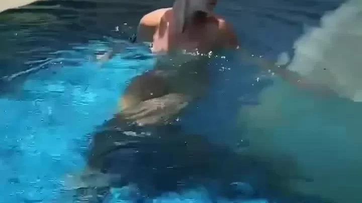 Slim white girl in pool outdoor