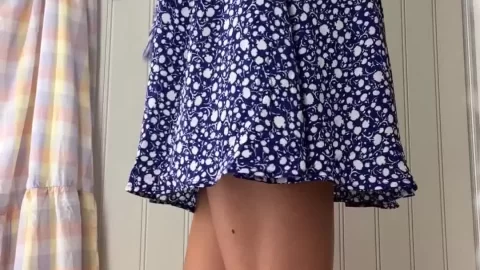 Slim brunette in dress gets ready