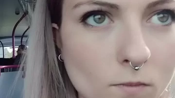 Blonde girl takes selfie on bus or train