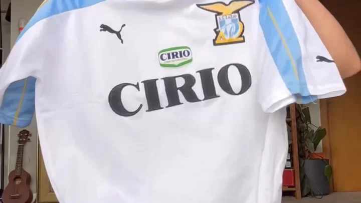 Teen with ponytail plays guitar naked then wears soccer jersey
