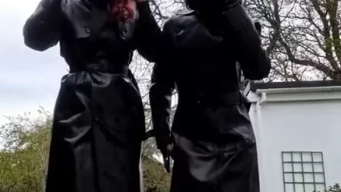Redhead and brunette girls in black gear