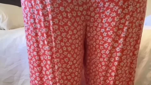 curvy brunette in red pajamas shows butt