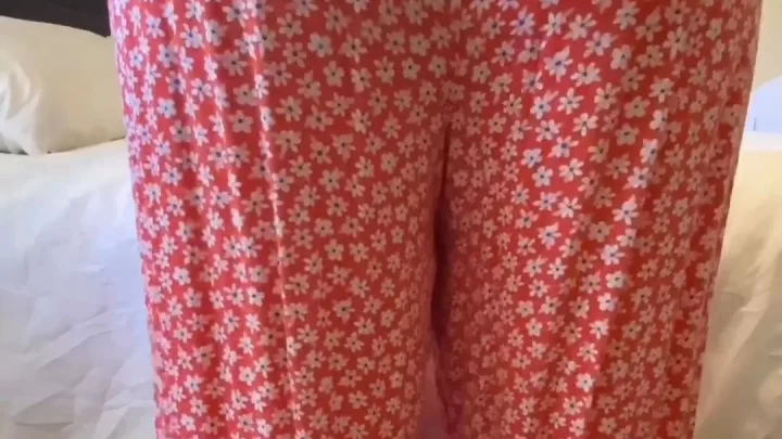 curvy brunette in red pajamas shows butt