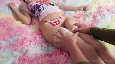 Blonde girl gets fucked with vibrator on rainbow rug