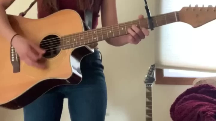 Teen girl plays guitar, strips