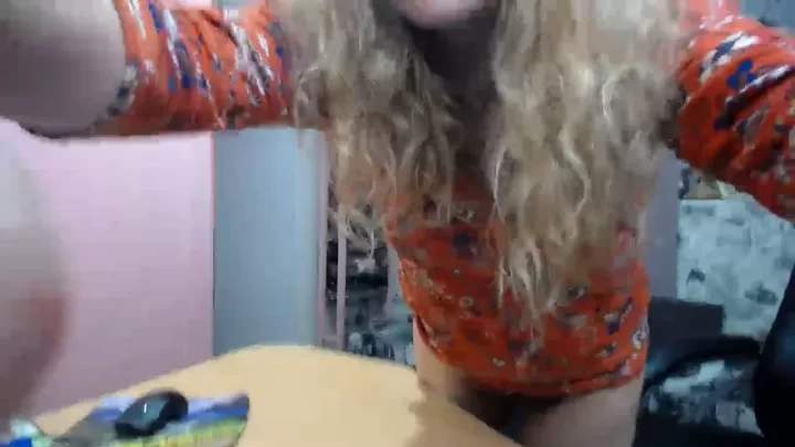 Blonde girl plays with herself at desk