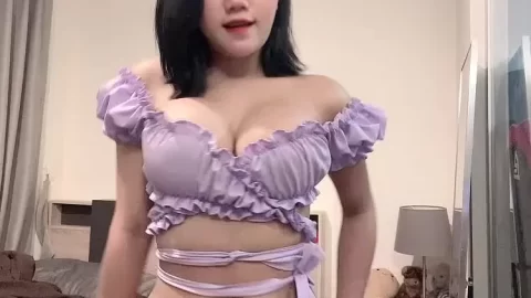 Slim East Asian girl with navel piercing fucks herself