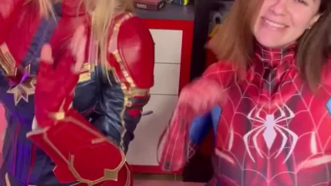 Blonde and brunette girls in superhero costumes fuck