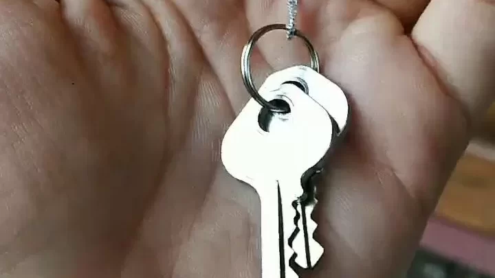 Slim guy with hairy arm and key pendant