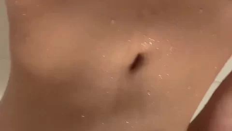 Asian girl showers, shows off body