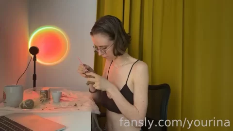 Brunette girl plays with herself at desk