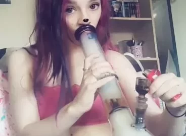 Redheaded girl smokes bong, gets intimate