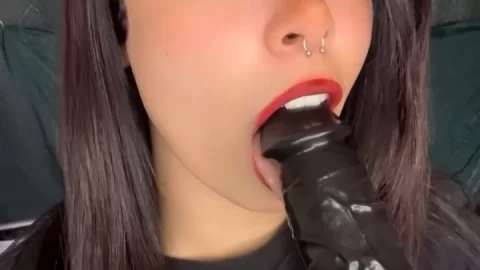 Slim white girl with tattoos gives herself a blowjob
