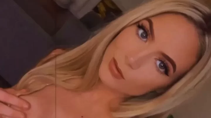 Blonde girl in lingerie poses and touches herself