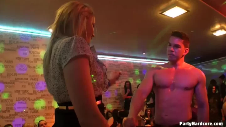 Blonde girls dance and get intimate in a nightclub