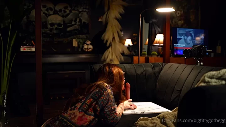 Brunette with Tattoos Exposes Breasts on Couch