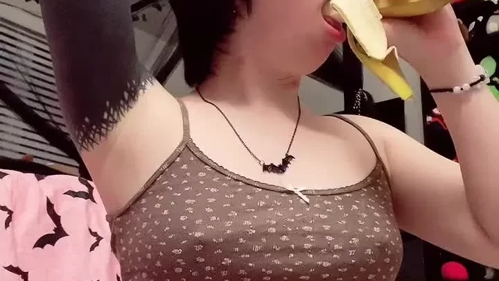 Asian petite girl eats banana, plays with herself