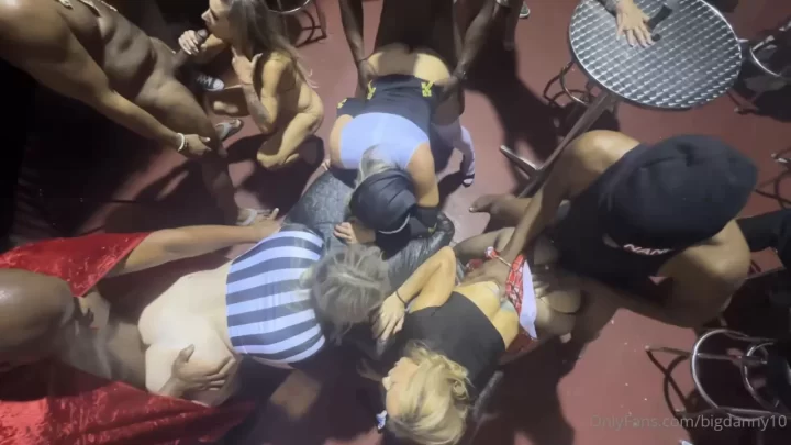 Blonde and brunette girls get down in a club