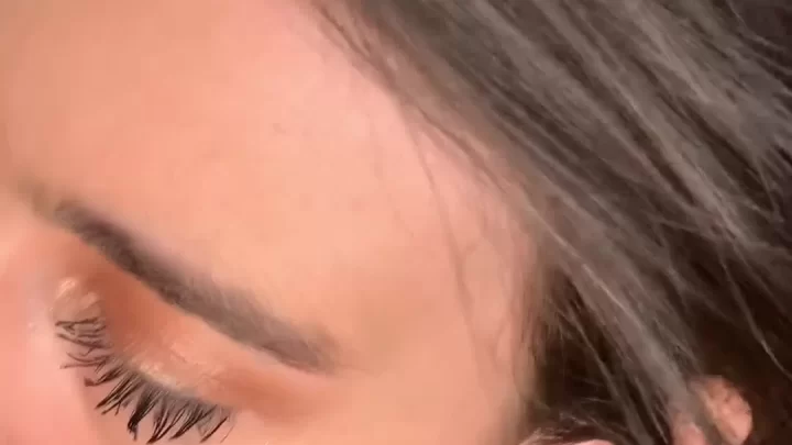 Brunette girl gets naked on couch