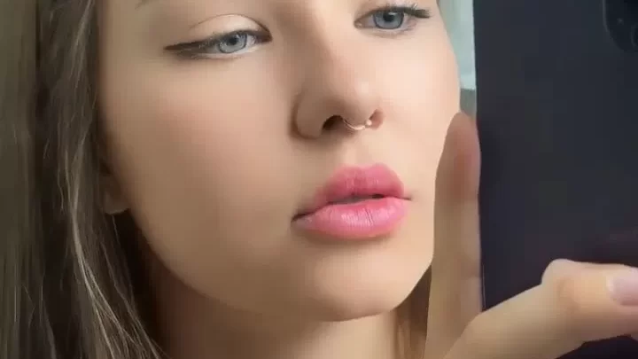 Teen girl takes selfie while puckering up