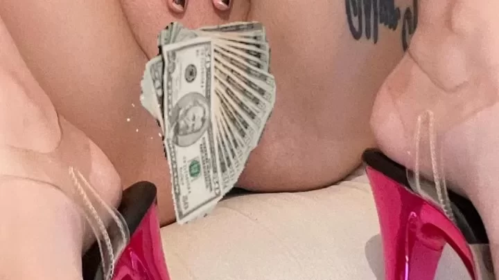 Slim white girl plays with cash in high heels