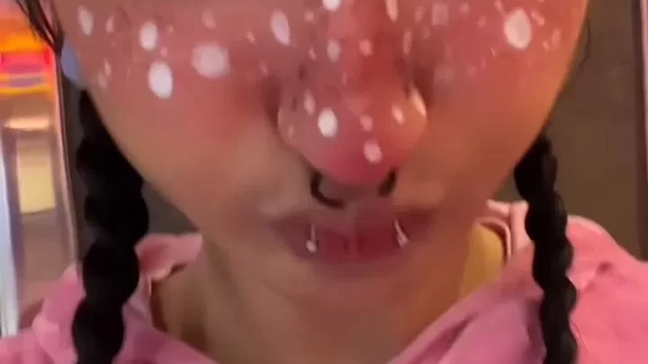 Slim 20s girl with dark braids and face tats gets up close