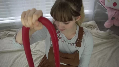 Blonde teen with pierced nose fucks herself with red dildo