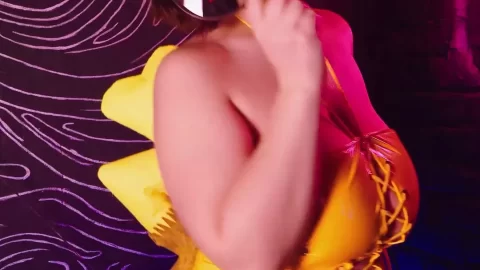 Brunette in Yellow Latex Gets Playful