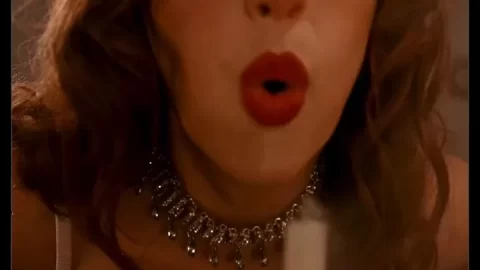 Redhead in Lingerie Drinks Champagne