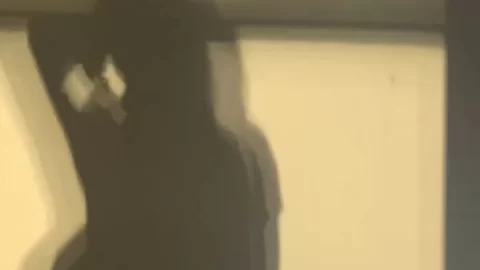 dark haired girl dancing indoor