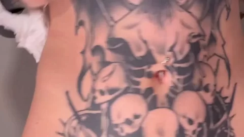 Redheaded Woman with Tattoos Cleans and Exposes Body
