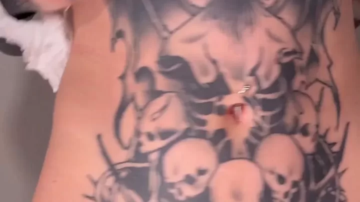 Redheaded Woman with Tattoos Cleans and Exposes Body
