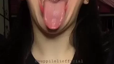 Asian Girl Licks Lips, Winks, and Plays with Hair