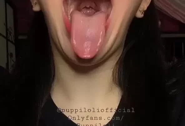 Asian Girl Licks Lips, Winks, and Plays with Hair