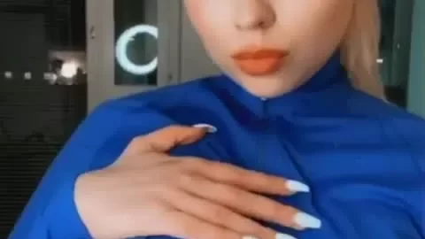 Blonde Girl Exposes Breasts in Apartment