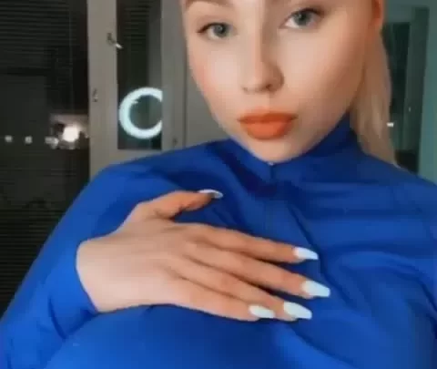 Blonde Girl Exposes Breasts in Apartment
