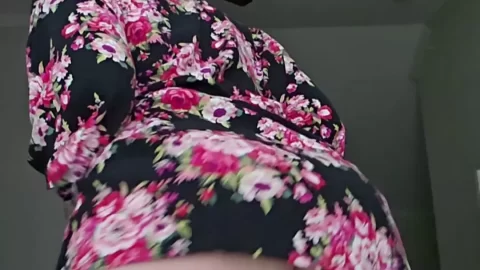 Redhead bends over, shows off tattooed butt