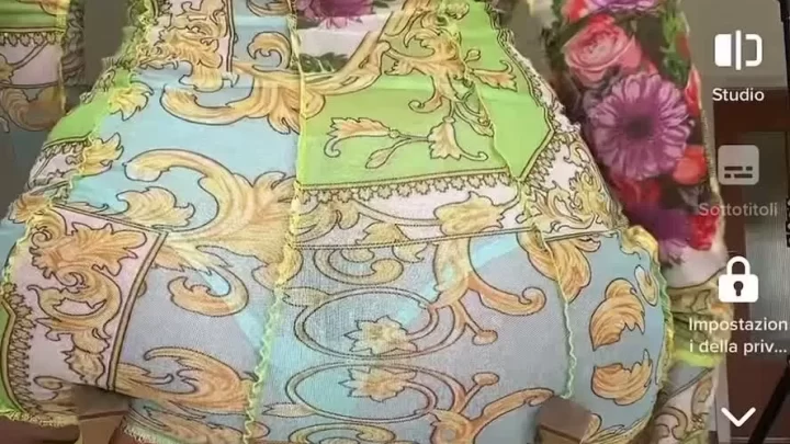 Brunette girl in colorful dress fucks herself