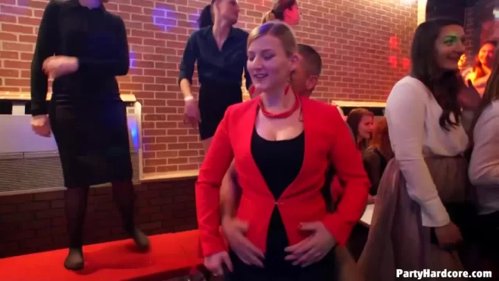 Blonde and brunette girls get intimate at a nightclub