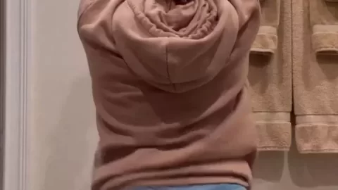 Teen girl in denim shorts gets dirty in bathroom