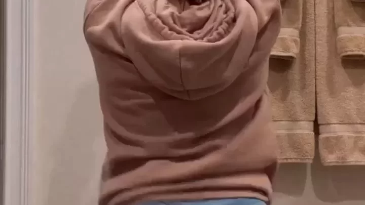 Teen girl in denim shorts gets dirty in bathroom