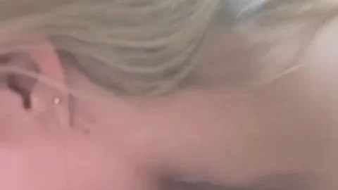 Blonde girl gives oral sex in a car