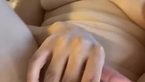 Brunette girl plays with herself on bed