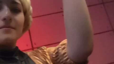 Blonde girl plays with black prop, close-ups