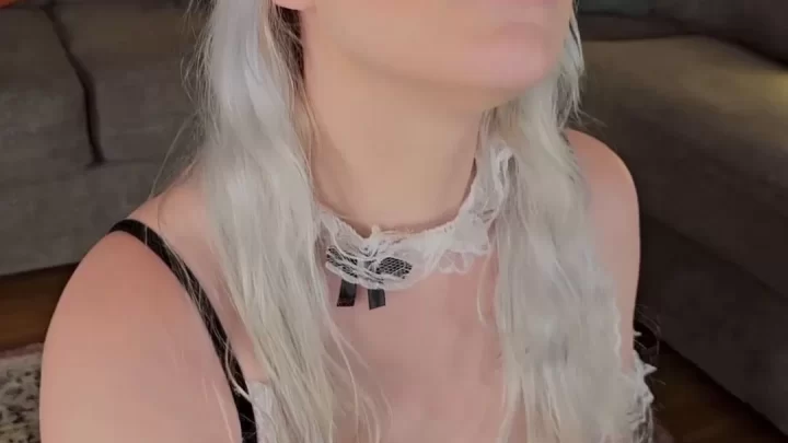 Blonde girl plays with toy, oral action