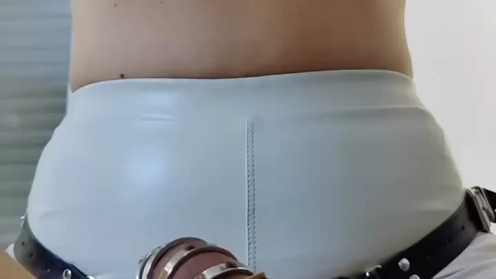 Blonde woman in cuffs exposes herself with toy