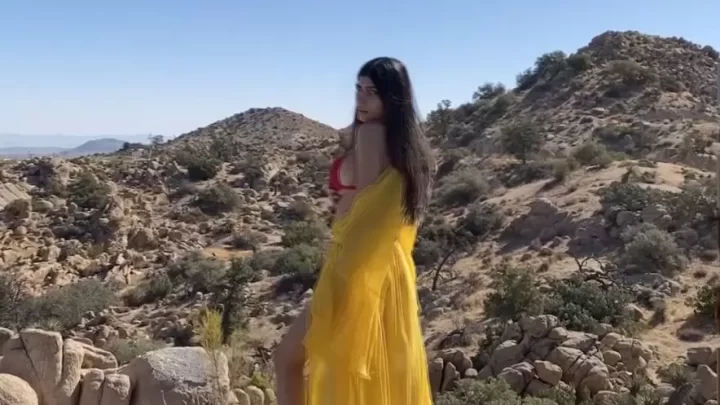 Brunette in Yellow Dress by Pool