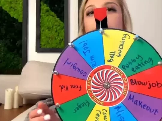 Blonde girl with piercing plays Wheel of Fortune topless
