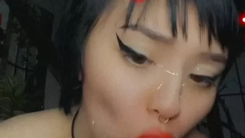 Asian girl plays with purple toy