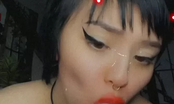 Asian girl plays with purple toy